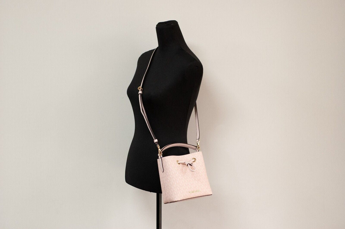 Suri Small Dark Powder Blush Signature PVC Bucket Crossbody Handbag